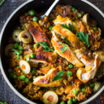 Instant Pot Arroz con Pollo - made in a fraction of the time! This Spanish version is infused with saffron and smoked paprika and full of amazing flavor! #instantpotchicken #instantpotrecipes #spanishchicken #easydinners #ArrozconPollo