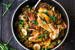 Instant Pot Arroz con Pollo - made in a fraction of the time! This Spanish version is infused with saffron and smoked paprika and full of amazing flavor! #instantpotchicken #instantpotrecipes #spanishchicken #easydinners #ArrozconPollo