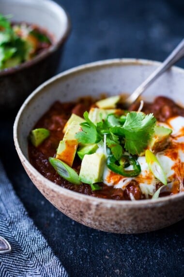 This hearty Instant Pot Chili recipe is made with dried beans and your choice of ground meat (beef, turkey or chicken) or try vegan soy crumbles! Vegan-adaptable! Serve it up with Our Favorite Homemade Cornbread. Video.