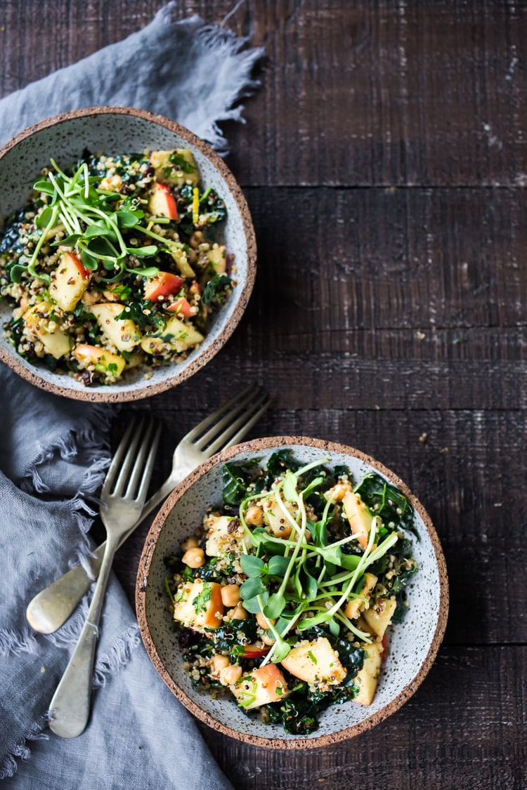 Winter Happiness Salad! Kale & Quinoa Salad with Apples, Chickpeas and Currants! A hearty vegan salad that can be made ahead- perfect for potlucks, gatherings or midweek lunches! #kalesalad #vegansalad #quinoasalad #chickpeasalad #healthysalad #potluck