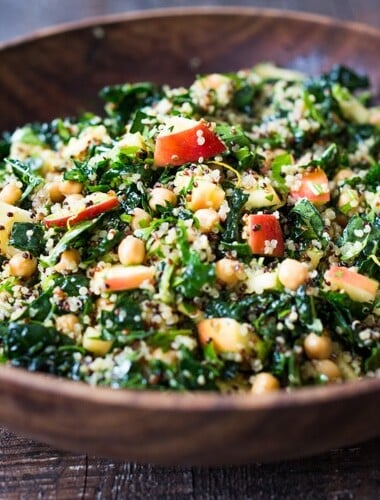 Winter Happiness Salad! Kale Quinoa Salad with Apples, Chickpeas and Currants! A hearty vegan salad that can be made ahead- perfect for potlucks, gatherings or midweek lunches! #kalesalad #vegansalad #quinoasalad #chickpeasalad #healthysalad #potluck