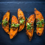 Roasted Sweet Potatoes with Miso, Ginger and Scallions - an easy vegan side that is healthy and full of amazing flavor! #sweetpotatoes #yams #veganside #miso#roastedsweetpotatoes #vegan #cleaneating #plantbased #veganside