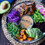 Bali Bowl with Peanut Tofu, black rice, roasted sweet potatoes, shredded cabbage, radish and snow peas. #peanutsauce #peanuttofu #healthybowl #veganbowls #buddhabowls #vegan #plantbased #cleaneating #eatclean #detoxrecipes #balifood #balinese