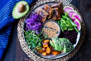 Bali Bowl with Peanut Tofu, black rice, roasted sweet potatoes, shredded cabbage, radish and snow peas. #peanutsauce #peanuttofu #healthybowl #veganbowls #buddhabowls #vegan #plantbased #cleaneating #eatclean #detoxrecipes #balifood #balinese