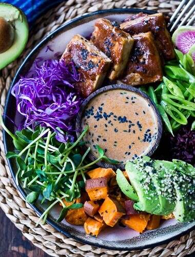 Bali Bowl with Peanut Tofu, black rice, roasted sweet potatoes, shredded cabbage, radish and snow peas. #peanutsauce #peanuttofu #healthybowl #veganbowls #buddhabowls #vegan #plantbased #cleaneating #eatclean #detoxrecipes #balifood #balinese