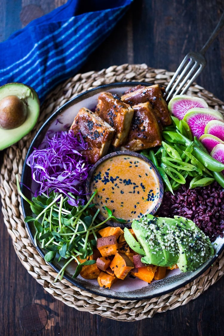 40 Mouthwatering Vegan Dinner Recipes!| Bali Bowl with Peanut Tofu, black rice, roasted sweet potatoes, shredded cabbage, radish and snow peas. #peanutsauce #peanuttofu #healthybowl #veganbowls #buddhabowls #vegan #plantbased #cleaneating #eatclean #detoxrecipes #balifood #balinese