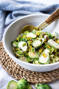 Lemony Brussel Sprout Salad with Creamy Tahini Sauce and Pistachios - a tasty, vegan salad that can be made ahead. Perfect for midweek lunches or potlucks or gatherings. #brusselsprouts #brusselsproutsalad #brusselsproutslaw #brusselsproutsrecipes #vegan #plantbased #cleaneating #eatclean #vegansalad