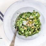 Spring Nettle Pesto Pasta with toasted pine nuts and lemon zest. Full of nutrients and so delicious! #nettles #nettlerecipes #nettlepesto | www.feastingathome.com