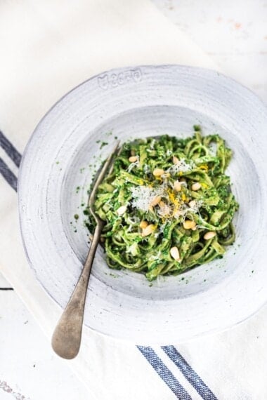 Spring Nettle Pesto Pasta with toasted pine nuts and lemon zest. Full of nutrients and so delicious! #nettles #nettlerecipes #nettlepesto | www.feastingathome.com