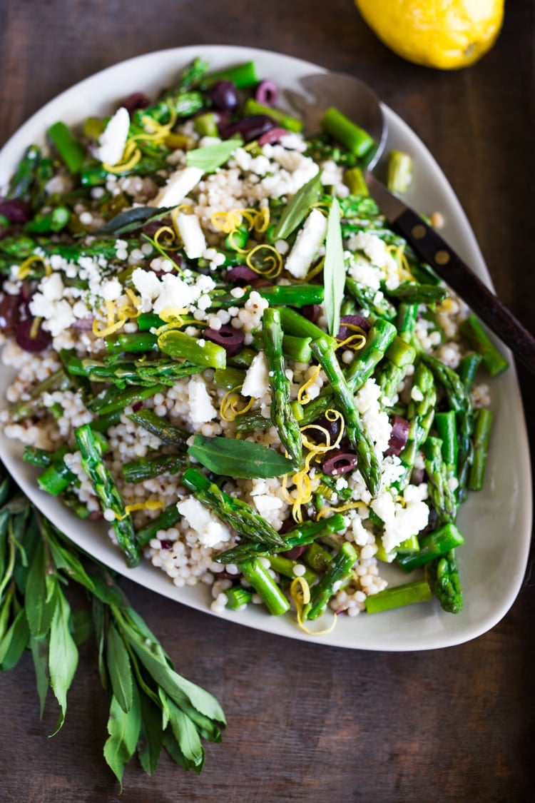 Spring Asparagus Salad with Israeli Cous Cous ( or use a grain!) kalamata olives, feta, lemon zest and mint with a lemony dressing. #asparagus #asparagussalad 