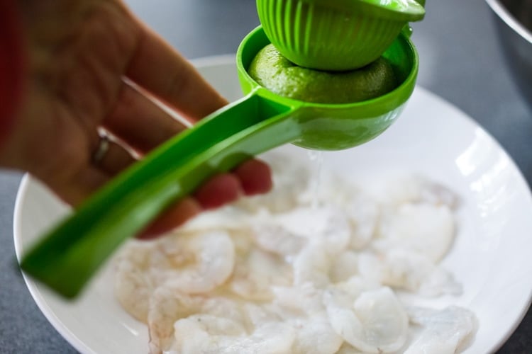 An authentic Mexican recipe for Aguachile with Shrimp! Similar to ceviche, shrimp is sliced in half, and cooked in a mixture of lime juice, chiles and cilantro. Flavorful, simple and sooooo delicious! #aguachile #shrimp #verde #ceviche #Mexican