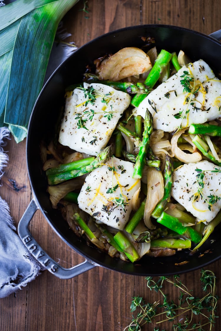 Baked Cod with Asparagus, Fennel and Leeks - a simple, spring-inspired dinner! #bakedcod #cod #codrecipes #recipes #fish #bakedfish #springrecipes #ketorecipes #lowcarb 