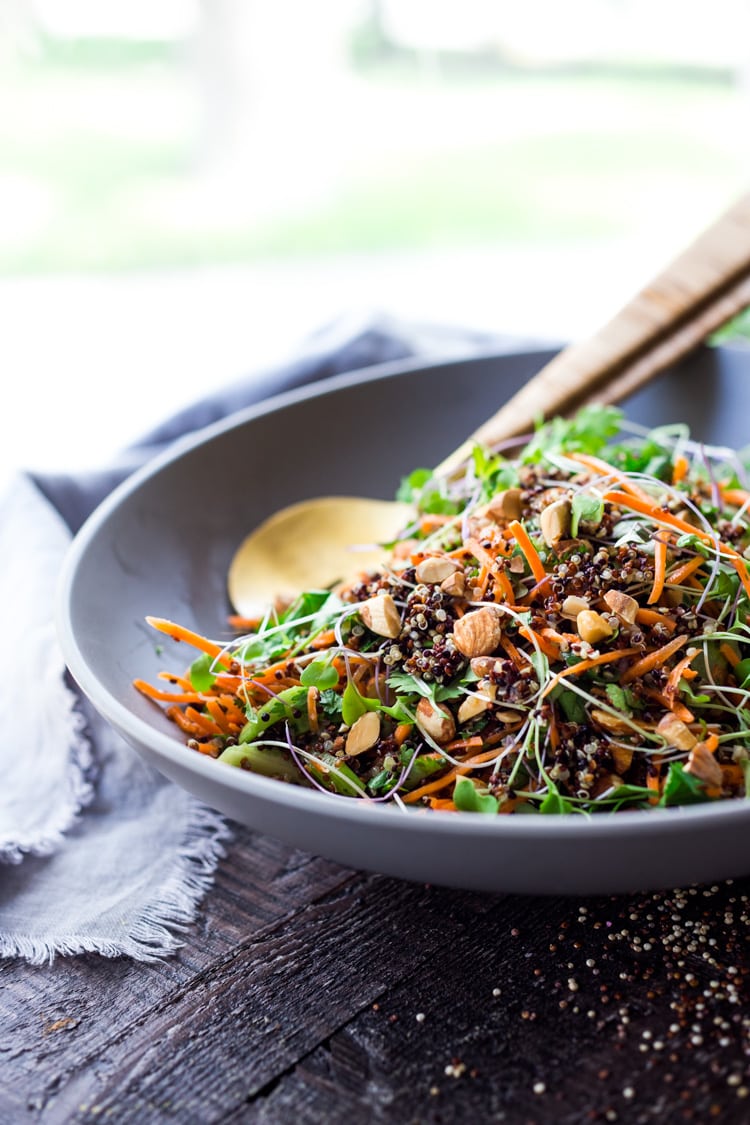 Carrot Quinoa Salad with Almonds and Raw Apple Cider Vinaigrette- a delicious vegan salad that can be made ahead. #vegan #quinoa #quinoasalad #carrotsalad #vegansalad 