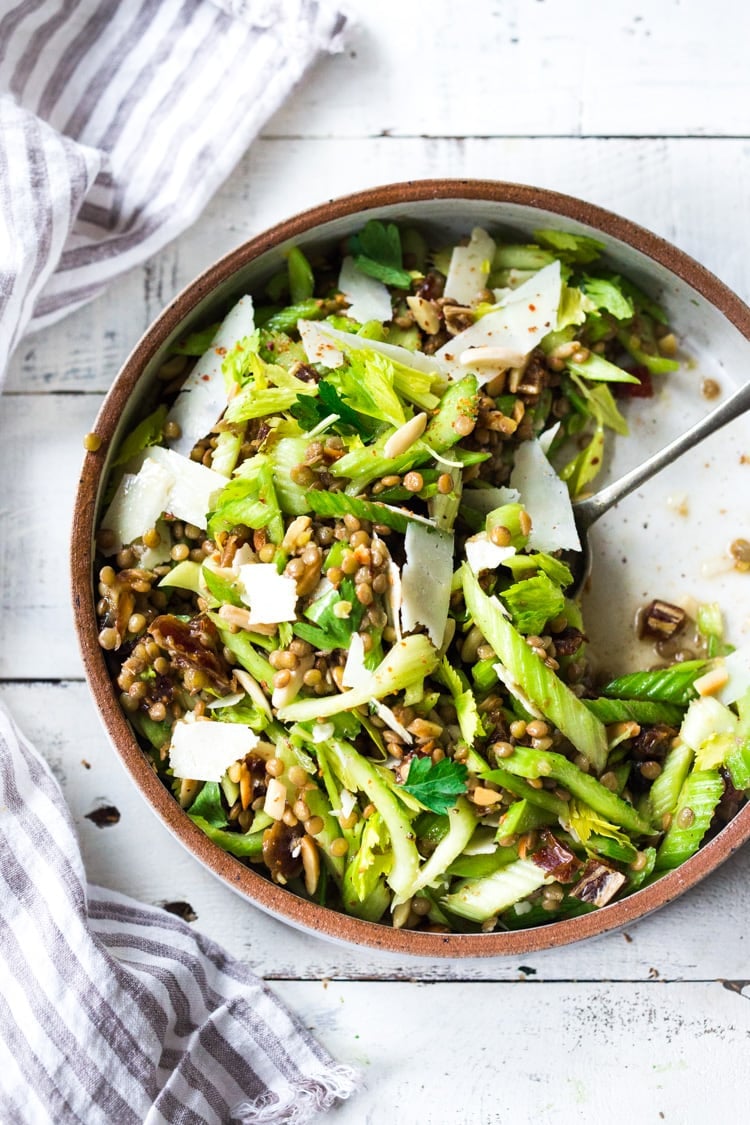 Celery Salad with lentils, dates and almonds - a delicious make ahead salad that keeps for several days in the fridge. Keep it vegan or add shaved pecorino! #celerysalad #lentilsalad #healthysalad #salad #vegansalad