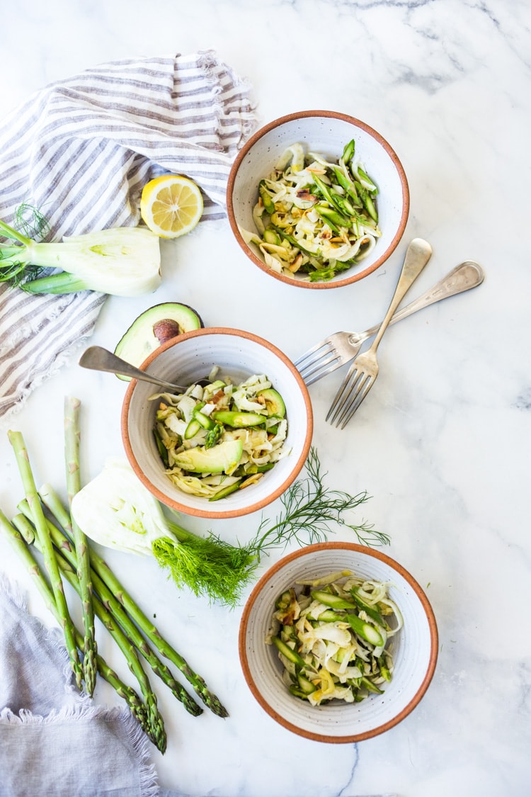 Fennel Asparagus Salad with Almonds and Lemony Leek Dressing. This vegan salad can be made ahead, a perfect side to fish, chicken or tofu. #fennel #fennelsalad #asparagus #vegansalad #eatclean #leeks #recipe #slaw #vegan #plantbased 