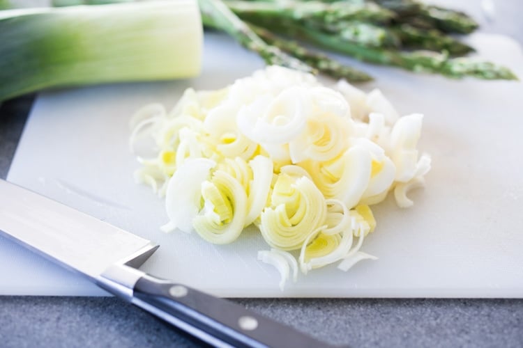 Chopped leeks in asparagus salad.