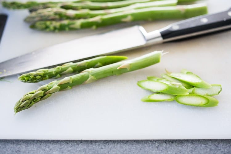 Cutting asparagus for asparagus salad.