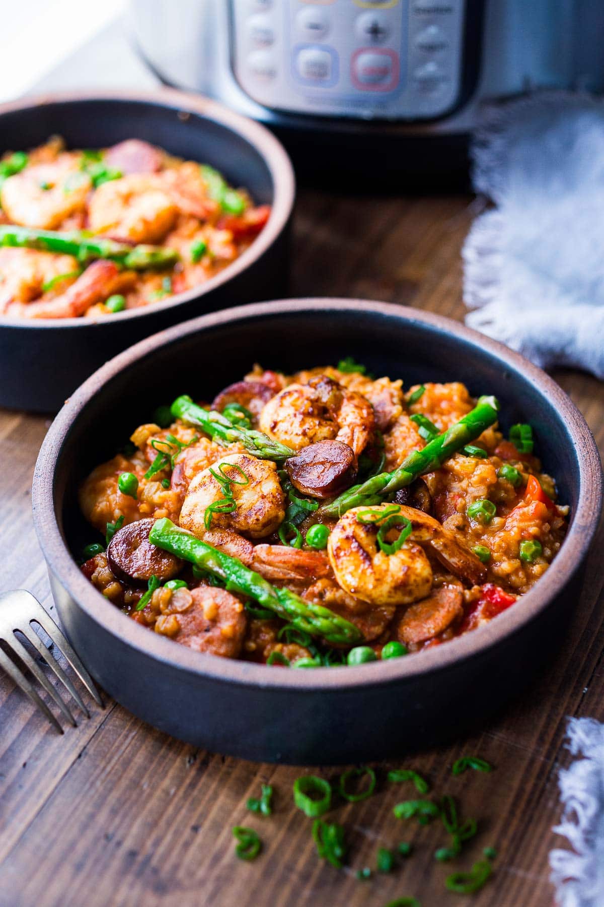 Jambalaya in a bowl with veggies. 