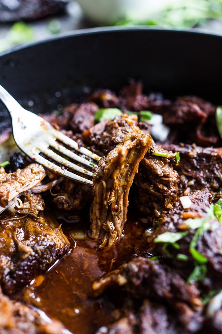 Mexican Lamb Barbacoa - a simple delicious recipe from Oaxaca that results in tender, juicy falling off the bone lamb perfect for tacos and burritos! #tacos #barbacoa #lamb #lambrecipes #oaxaca #mexicanrecipes #cincodemayo 