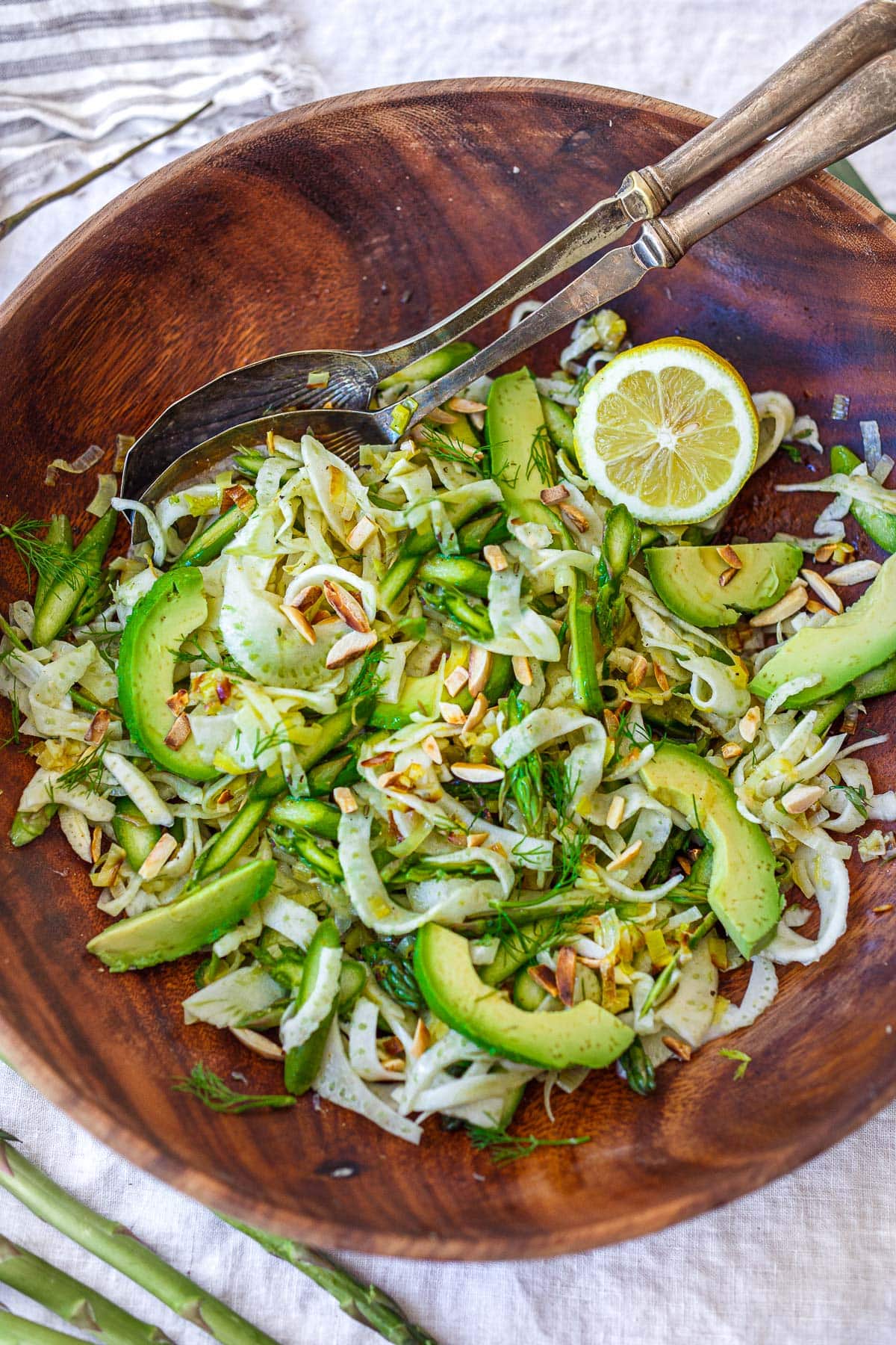 One of our favorite spring salads, this Asparagus Salad is made with shaved raw asparagus and fennel bulb, avocado, and toasted, slivered almonds, tossed in the most delicious Lemony Leek Dressing.