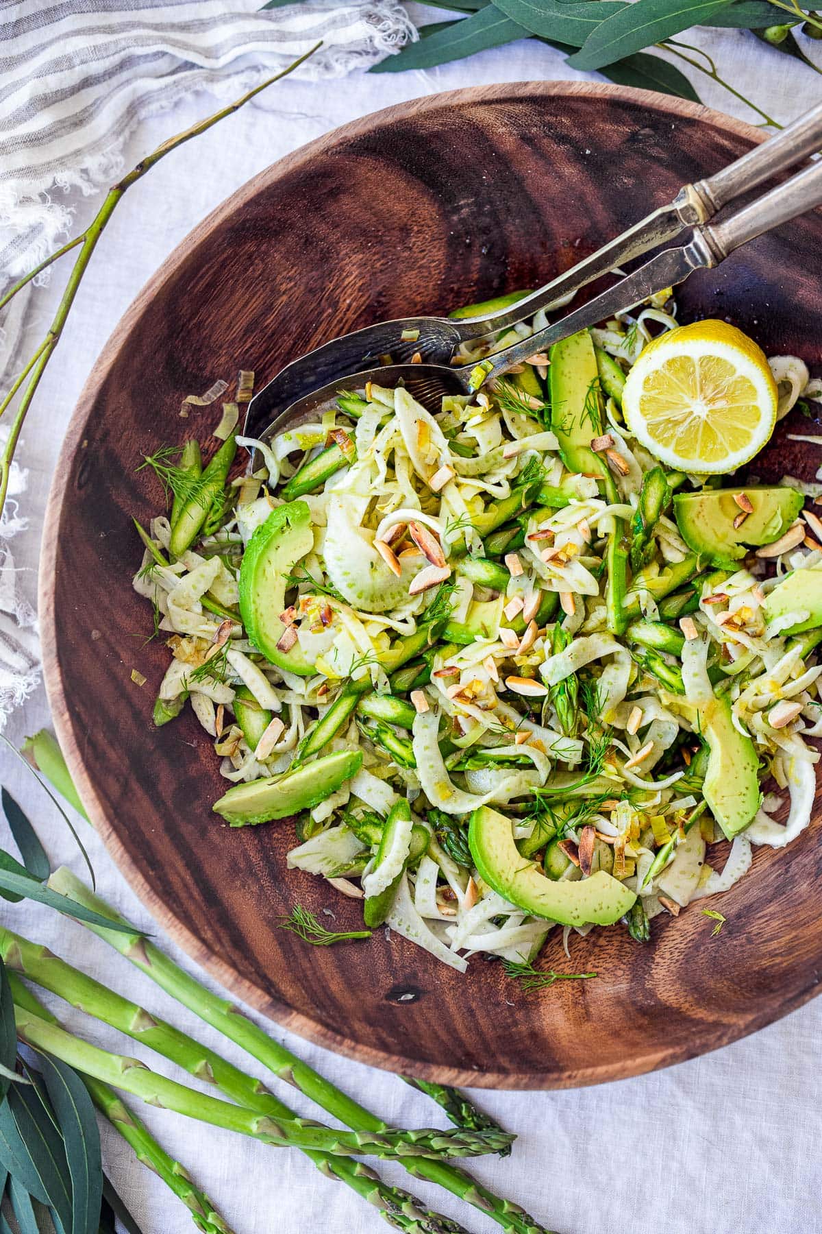 One of our favorite spring salads, this Asparagus Salad is made with shaved raw asparagus and fennel bulb, avocado, and toasted, slivered almonds, tossed in the most delicious Lemony Leek Dressing.