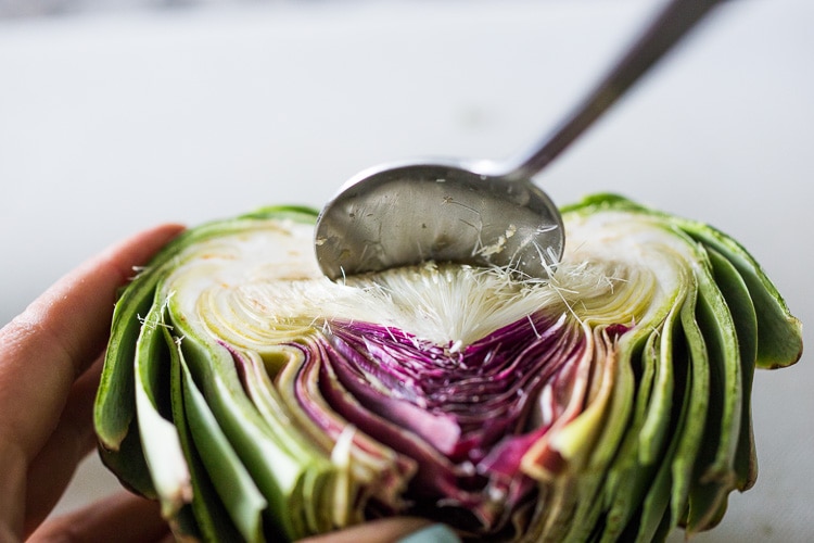 How to roast Artichokes! Roasted Artichokes with Lemony Leek dressing - a healthy vegan way to cook and serve our favorite spring vegetable! #artichoke #artichokes #bakedartichokes #roastedartichokes #vegan #veganartichokesauce 