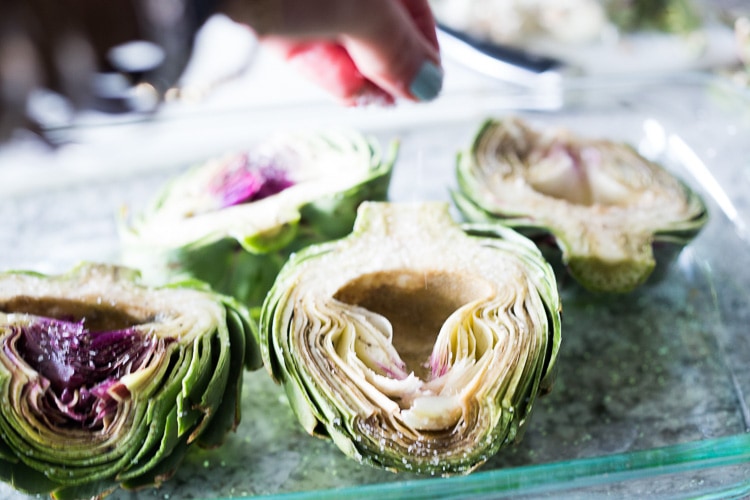 How to roast Artichokes! Roasted Artichokes with Lemony Leek dressing - a healthy vegan way to cook and serve our favorite spring vegetable! #artichoke #artichokes #bakedartichokes #roastedartichokes #vegan #veganartichokesauce 