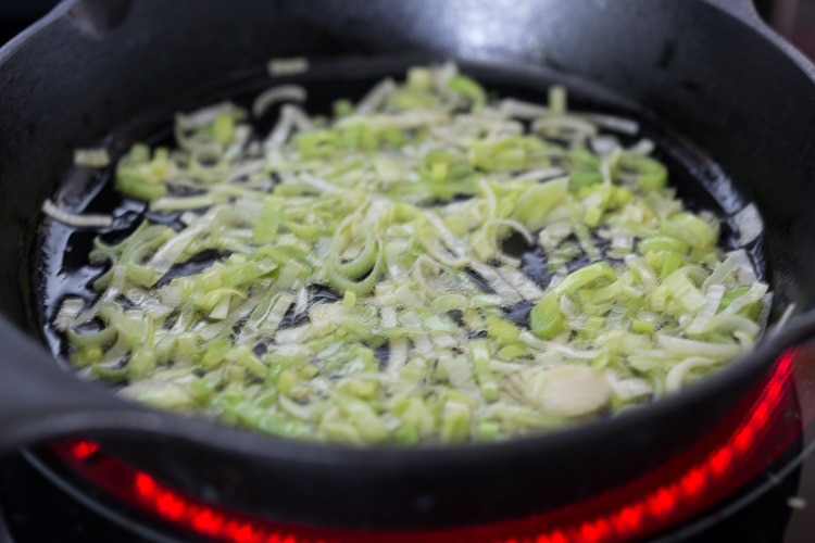 How to roast Artichokes! Roasted Artichokes with Lemony Leek dressing - a healthy vegan way to cook and serve our favorite spring vegetable! #artichoke #artichokes #bakedartichokes #roastedartichokes #vegan #veganartichokesauce 