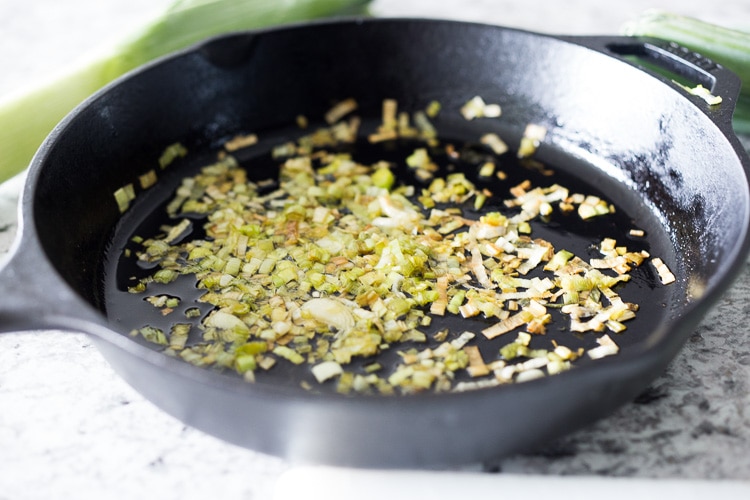 How to roast Artichokes! Roasted Artichokes with Lemony Leek dressing - a healthy vegan way to cook and serve our favorite spring vegetable! #artichoke #artichokes #bakedartichokes #roastedartichokes #vegan #veganartichokesauce 