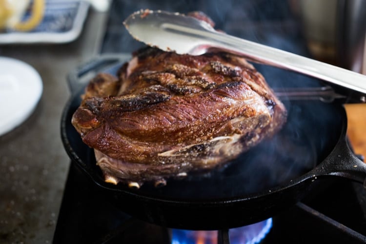 searing the barbacoa roast.