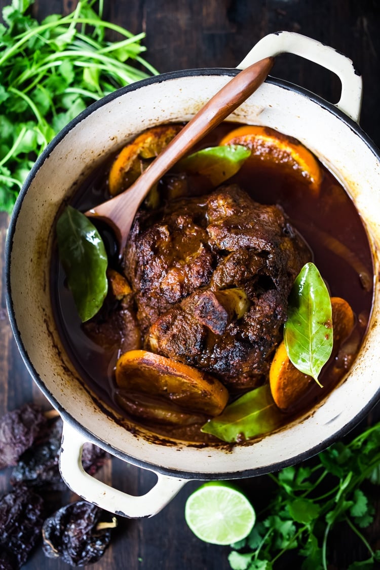 Mexican Lamb Barbacoa - a simple delicious recipe from Oaxaca that results in tender, juicy falling off the bone lamb perfect for tacos and burritos! #tacos #barbacoa #lamb #lambrecipes #oaxaca #mexicanrecipes #cincodemayo 