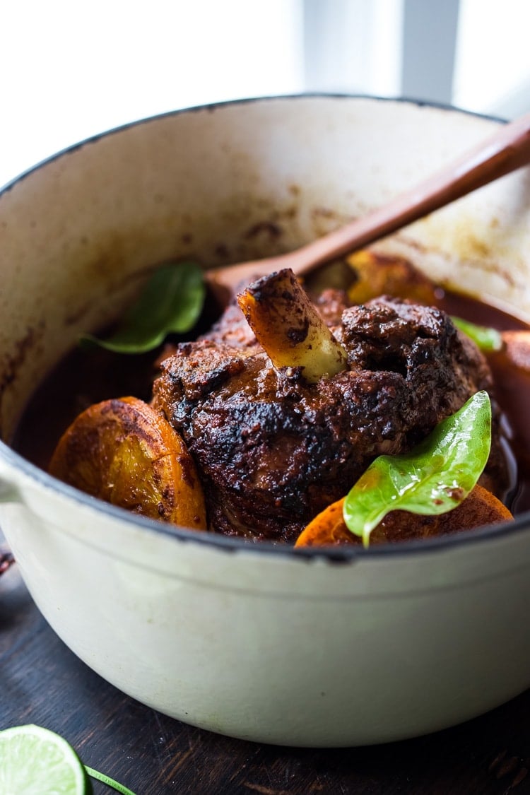 Mexican Lamb Barbacoa - a simple delicious recipe from Oaxaca that results in tender, juicy falling off the bone lamb perfect for tacos and burritos! #tacos #barbacoa #lamb #lambrecipes #oaxaca #mexicanrecipes #cincodemayo