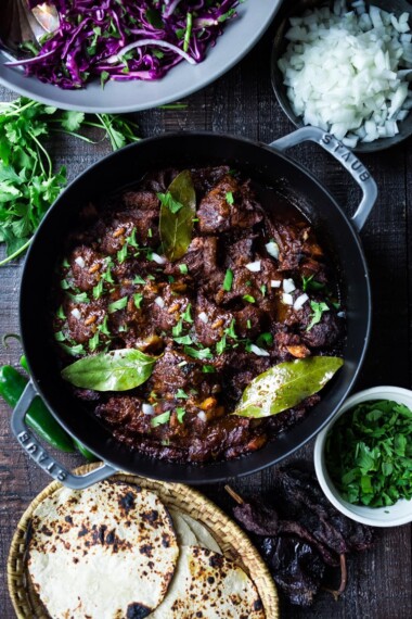 Mexican Lamb Barbacoa - a simple delicious recipe from Oaxaca that results in tender, juicy falling off the bone lamb perfect for tacos and burritos! #tacos #barbacoa #lamb #lambrecipes #oaxaca #mexicanrecipes #cincodemayo