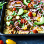 Nachos Supreme! These loaded vegetarian nachos are made with flavorful "walnut chorizo"! A healthy, delicious nacho recipe that is baked in the oven. Vegan-adaptable and Gluten free! #nachos #vegannachos #vegetarian