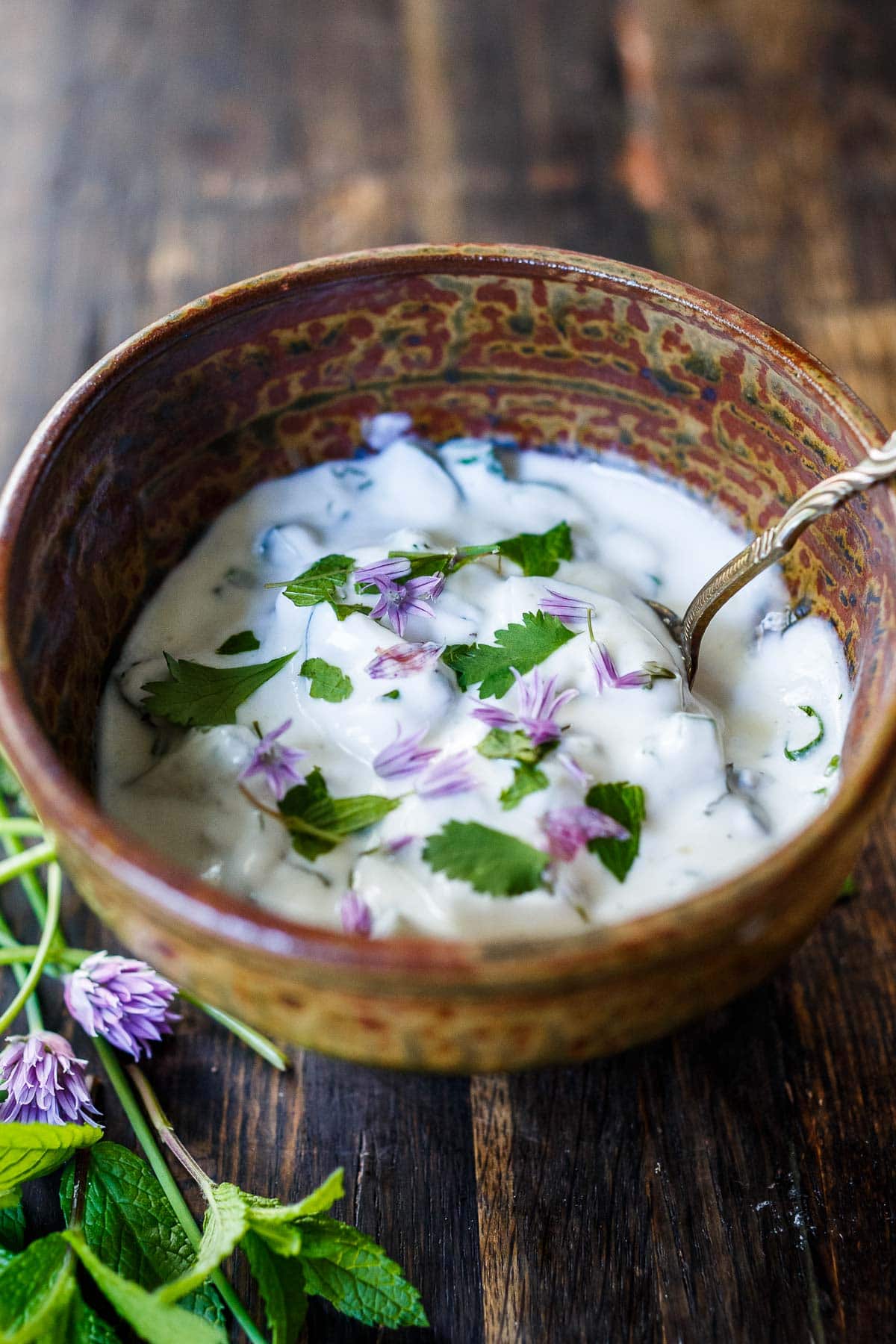 An authentic recipe for Raita- a creamy Indian yogurt sauce with cucumber, mint and cilantro. Cooling and refreshing, serve this with spicy Indian dishes to help cool the palate.