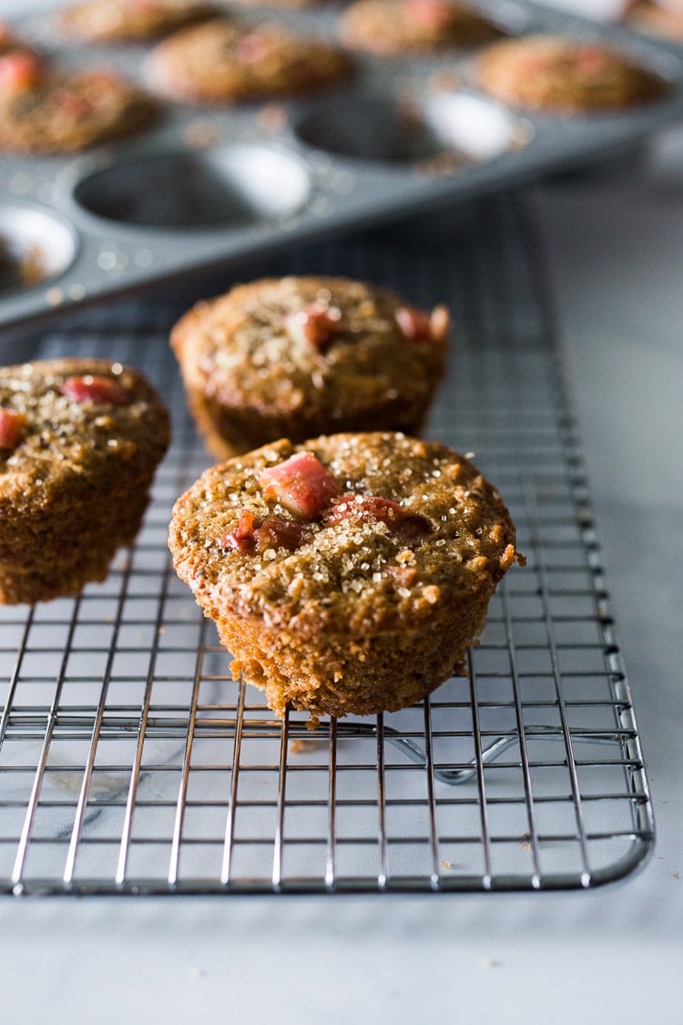 Rhubarb Muffins- a simple healthy one-bowl muffin recipe made with oats, your choice of flour, optional seeds and nuts, sweetened with maple syrup. Vegan and GF adaptable!  #rhubarb #rhubarbmuffins #rubbarbrecipes #muffins #spelt #chia #almonds