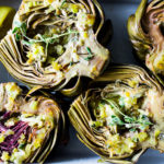 Roasted Artichokes with Lemony Leek dressing - a healthy vegan way to cook and serve our favorite spring vegetable! #artichoke #artichokes #bakedartichokes #roastedartichokes #vegan #veganartichokesauce