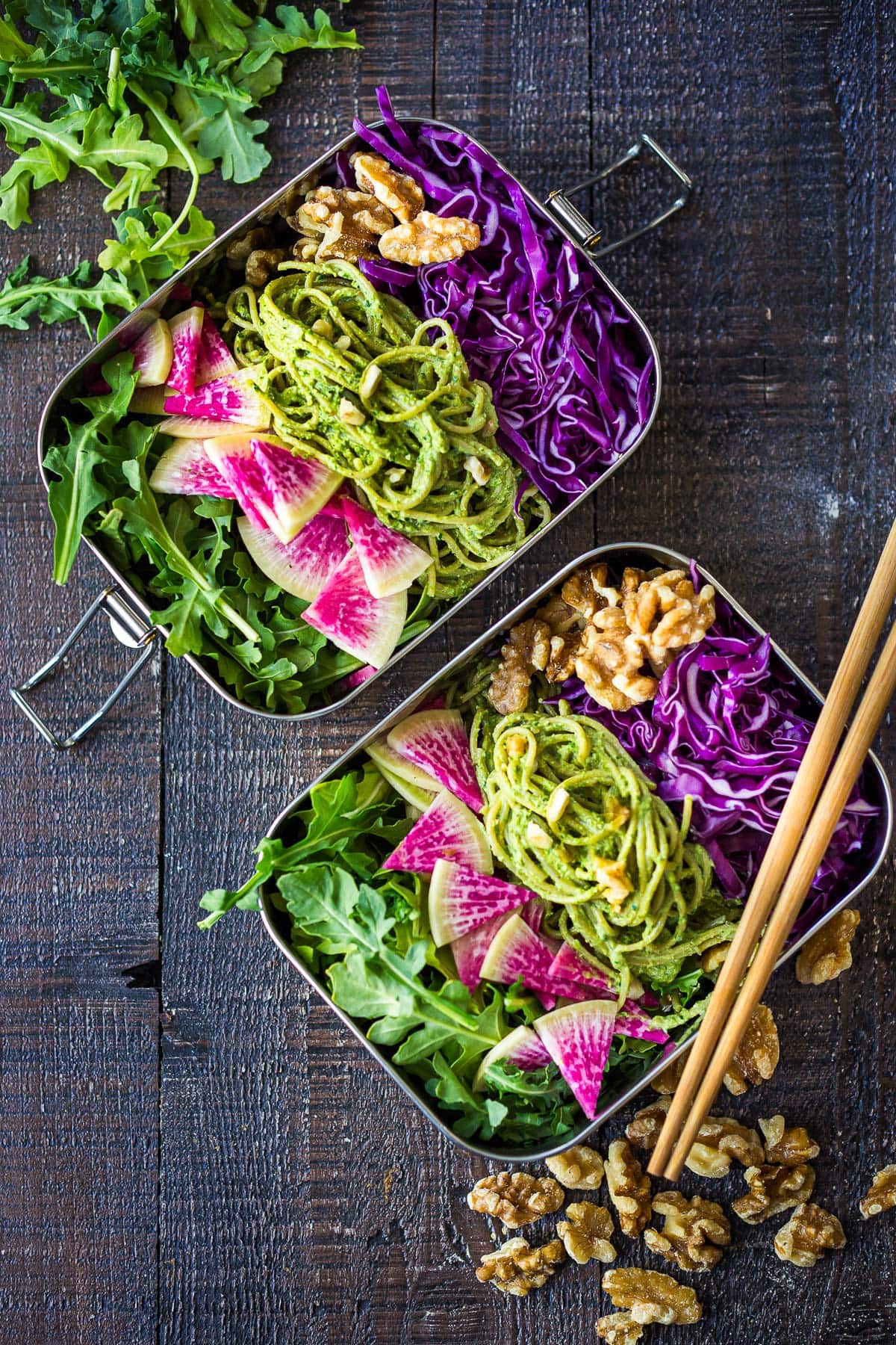 walnut pesto tossed with noodles in a bento box with fresh veggies.