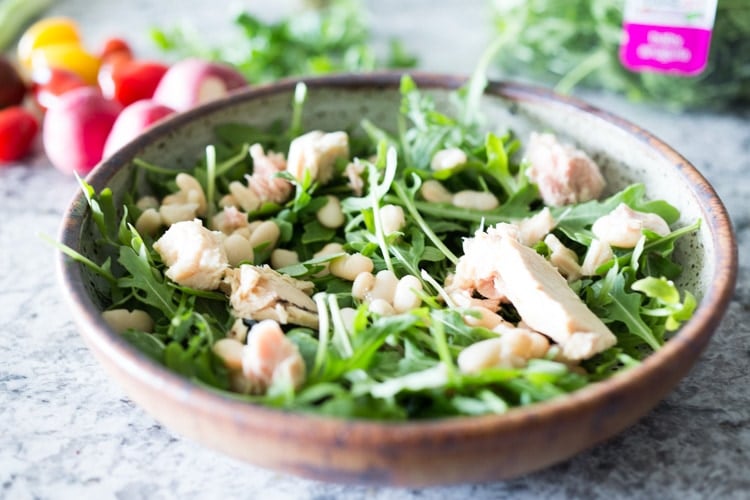 A simple recipe for Tuscan White Bean & Tuna Salad with arugula, radishes, tomatoes and a simple balsamic vinaigrette. #tunasalad #whitebeans #tunarecipes #salad #healthysalad #tuscansalad 