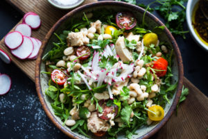 A simple recipe for Tuscan White Bean & Tuna Salad with arugula, radishes, tomatoes and a simple balsamic vinaigrette. #tunasalad #whitebeans #tunarecipes #salad #healthysalad #tuscansalad