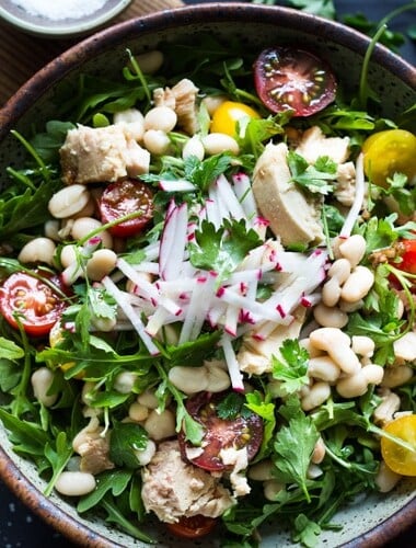 A simple recipe for Tuscan White Bean & Tuna Salad with arugula, radishes, tomatoes and a simple balsamic vinaigrette. #tunasalad #whitebeans #tunarecipes #salad #healthysalad #tuscansalad