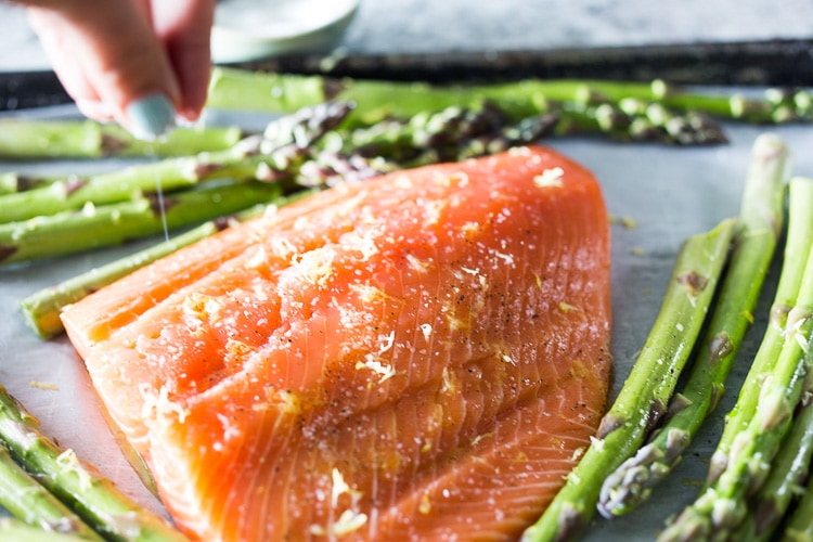 Roasted Salmon with Asparagus and Dill Sauce and simple sheet-pan dinner that comes together in 30 minutes. #salmon #roastedsalmon #bakedsalmon #aspargus #dinner #sheetpandinner #easyrecipes