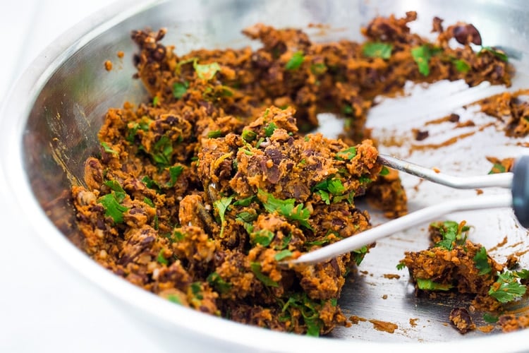 A quick and easy recipe for Smoky Chipotle Black Bean Burgers that can be made in under 30 minutes! Vegan adaptable and perfect for weekly meal prep! #blackbeanburger #veggieburger #veganburger #burger