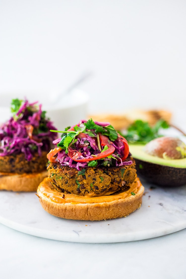 A quick and easy recipe for Smoky Chipotle Black Bean Burgers that can be made in under 30 minutes! Vegan adaptable and perfect for weekly meal prep! #blackbeanburger #veggieburger #veganburger #burger