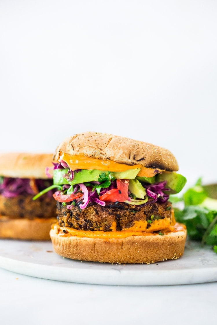 A quick and easy recipe for Smoky Chipotle Black Bean Burgers that can be made in under 30 minutes! Vegan adaptable and perfect for weekly meal prep! #blackbeanburger #veggieburger #veganburger #burger