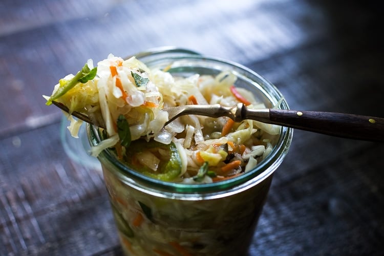 Curtido - A cultured Salvadorian Slaw with cabbage, carrots, onion and oregano. Simple to make, full of healthy probiotics! Use on Tacos, Pupusas, quesadillas or enchiladas as a delicious healthy condiment! #Curtido #fermented #slaw #cultured #kraut