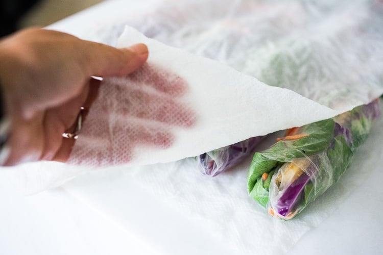 storing fresh spring rolls beneath damp paper towel.