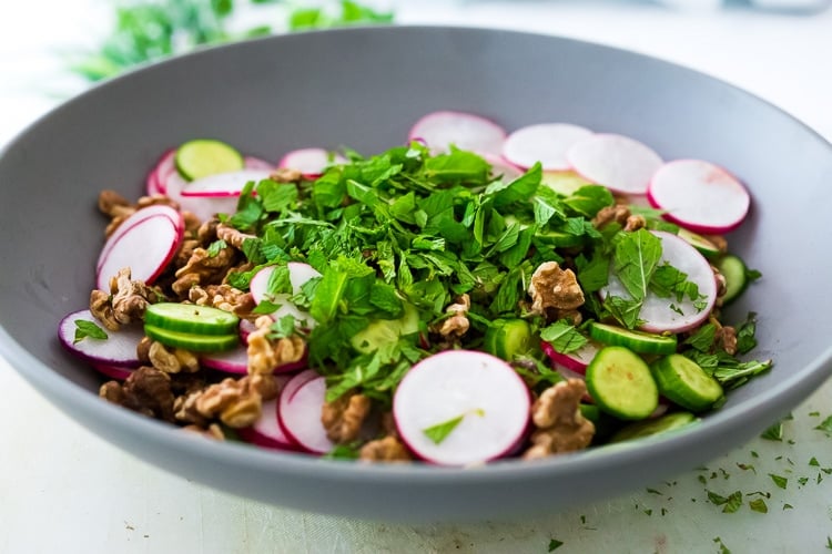 Persian Walnut Salad with Cucumbers, Radishes, Mint, Dill, Cilantro and Parsley. Loaded up with fresh herbs this refreshing summer salad is the perfect side to summer grilling! #walnuts #cawalnuts #walnutsalad #persiansalad #herbsalad #persianherbsalad