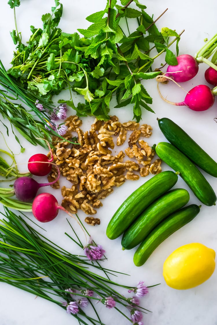 Persian Walnut Salad with Cucumbers, Radishes, Mint, Dill, Cilantro and Parsley. Loaded up with fresh herbs this refreshing summer salad is the perfect side to summer grilling! #walnuts #cawalnuts #walnutsalad #persiansalad #herbsalad #persianherbsalad