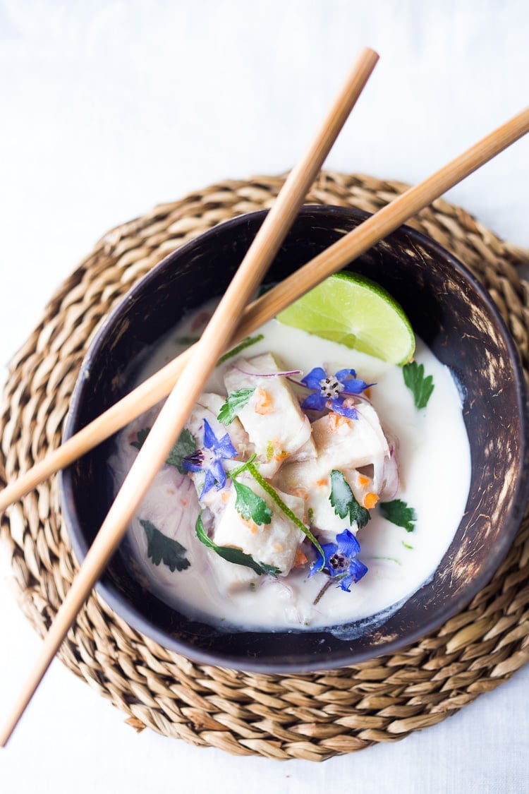 A simple delicious recipe for Peruvian Ceviche made with fish, chilies, lime, a splash of coconut milk and a hint of ginger. Easy, healthy flavorful! #ceviche #peruvianceviche #lechedetigre